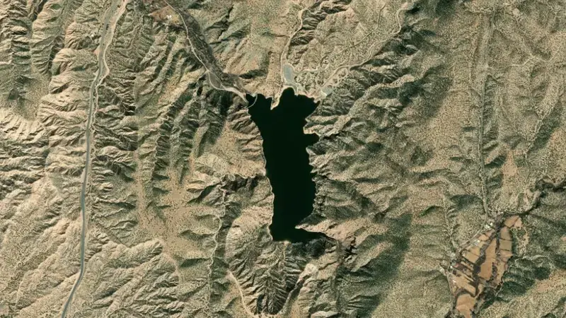 Satellite view of Nambe Falls Reservoir and Dam reservoir, New Mexico, United States